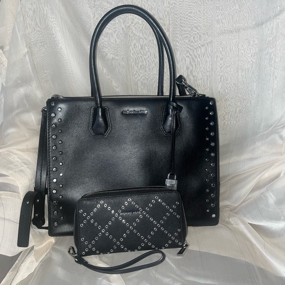 Michael Kors studded handbag with black wallet.